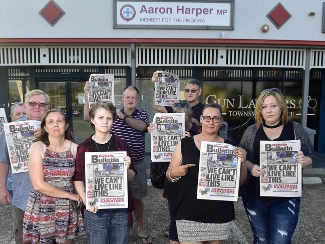 Townsville residents protest the city’s crime rate outside Member for Thuringowa Aaron Harper's office.