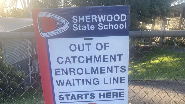 Sherwood State School was prepared for the demand, with a sign marking where parents should line up.