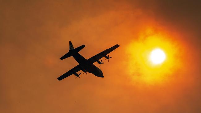 Apocalyptic skies on the NSW South Coast where firefighters worked desperately to save homes as the large fire approached Bawley Point. Picture Gary Ramage