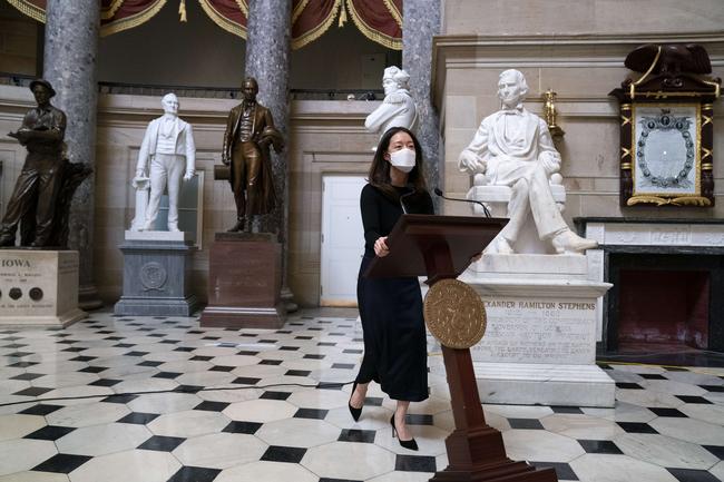 WASHINGTON, DC - JANUARY 13: An aide pushes a podium belonging to House Speaker Nancy Pelosi, which was stolen last week, through Statuary Hall at the U.S. Capitol on January 13, 2021 in Washington, DC. The House of Representatives is expected to vote to impeach President Donald Trump later today, after Vice President Mike Pence declined to use the 25th amendment to remove him from office after protestors breached the U.S. Capitol last week. Stefani Reynolds/Getty Images/AFP