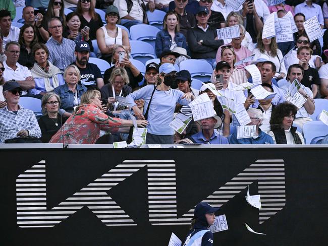 Other nearby spectators took it upon themselves to stop the woman and forcibly escort her away from the arena.