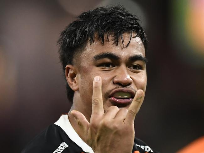 BRISBANE, AUSTRALIA - JULY 18: Junior Pauga of the Tigers celebrates after scoring a try during the round 18 NRL match between the Brisbane Broncos and the Wests Tigers at Suncorp Stadium, on July 18, 2021, in Brisbane, Australia. (Photo by Albert Perez/Getty Images)