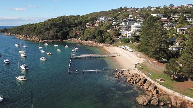 Cathedral rock is northwest of Forty Baskets Beach (pictured).