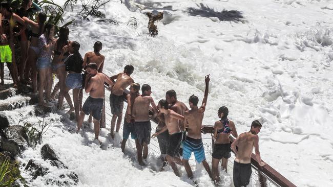 Teens flirt with danger as huge swell hits Snapper Rocks. Picture: NIGEL HALLETT