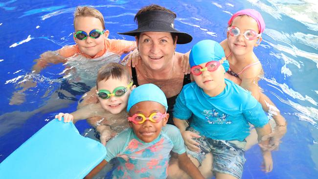 Veteran Cairns swim coach Janet Evans has backed SOS but thinks kids should be getting in the water from 5-6 months old. Janet is pictured with Dexter Britt-Pearson, Xander Goan, Loata Patterson, Jasmine Nielsen and Luke Britt-Pearson. PICTURE: JUSTIN BRIERTY