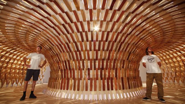 NGV workers stop to look at the Botanical Pavilion 2020 by Kengo Kuma & Associates and Geoff Nees. Picture: David Caird