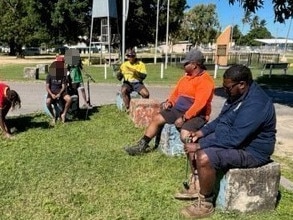 Members of the Palm Island night patrol group talking to youths in the town centre. Picture: Supplied