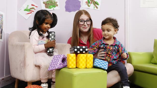 Childcare worker Hannah Joy from Clovel Child Care &amp; Early Learning Centre in Wentworthville with children Skyla, 2, (left) and Naira, 1. Picture: Jonathan Ng