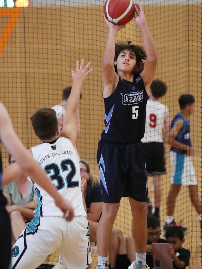 Basketball Queensland Under-16 Boys State Championships at the Coomera Indoor Sports Centre.Northside Wizards (Navy) v North Gold Coast Seahawks . Wizards Kaylan Jackson soars over Seahawks Cody Sidebottom Picture Glenn Hampson