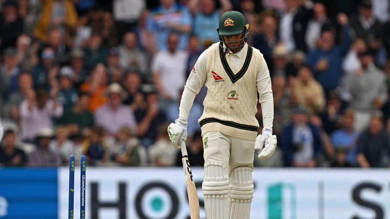 Australia's Usman Khawaja looks on after having his leg stump ripped out of the ground. Picture: AFP