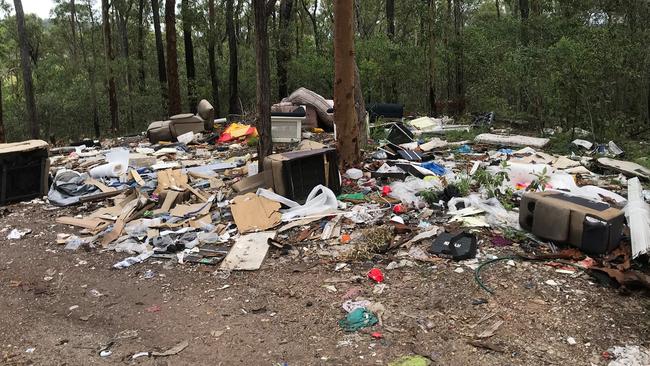 One of the piles of rubbish dumped off the side of Wuraga Rd at Beenleigh, less than 900m from the council tip, where it costs money to dump some items such as fridges, sofas and mattresses.