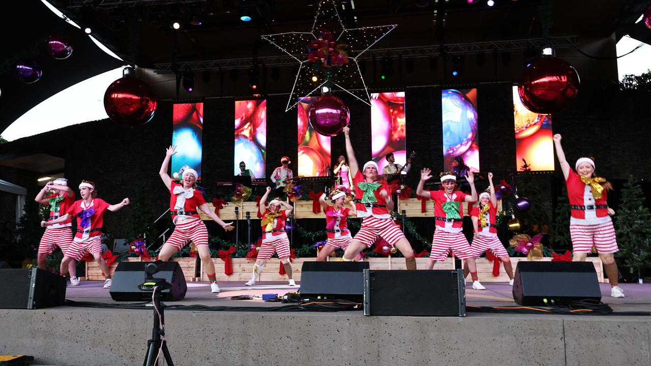 Naughty elves dance on stage at the Carols in the Park, held at Munro Martin Parklands. Picture: Brendan Radke