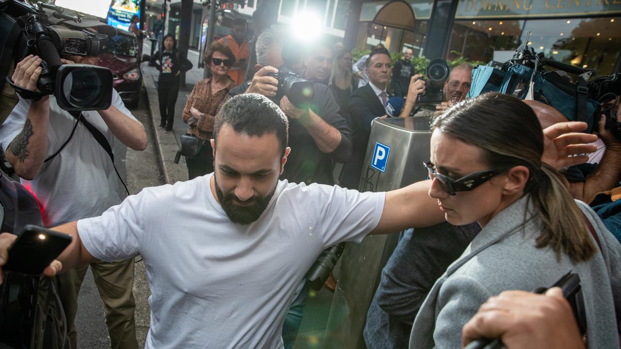 A massive media scrum were seen as Hayne and his wife Amellia Bonnici (right) were getting into their car outside court. Picture: NCA Newswire / Christian Gilles