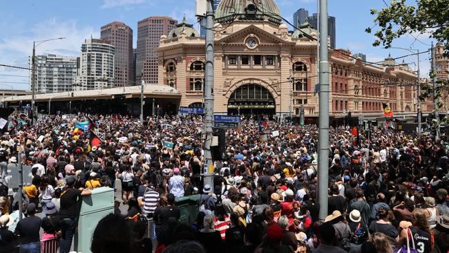 Huge crowds gather outside Flinders Street Station. Picture: Jake Nowakowski