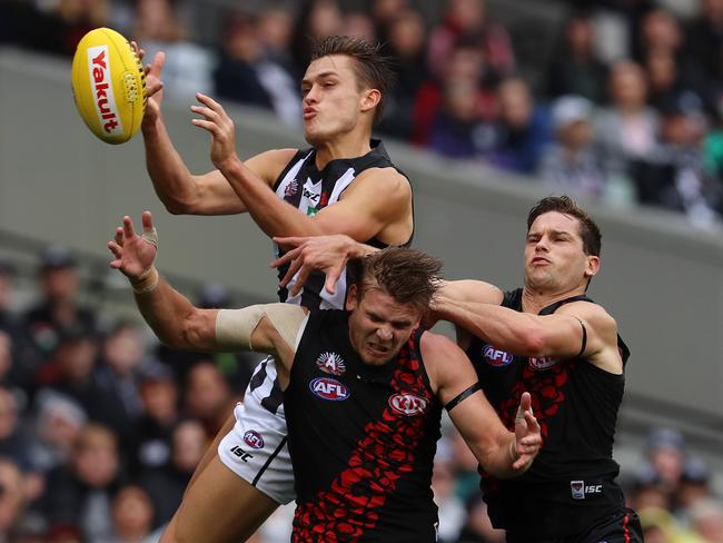 Darcy Moore climbs over Michael Hurley but drops the mark. Picture: Michael Klein