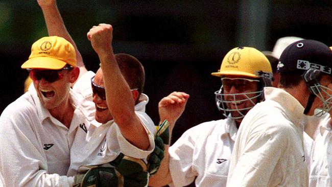 The Australian players celebrate a Brad Young hat-trick which he took against New Zealand.