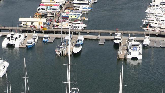 Superyachts at the Spit. The Shirley Anne (navy blue hull) docked at the Southport Yacht Club. Reporter: Jennifer Barwick