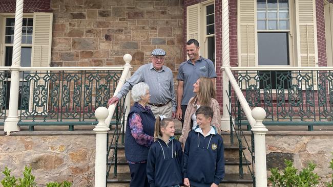 Previous owners Ron and Heather Campbell with new owners Jarrad and Cobi Christian and their children Nash and Emmi. Picture: Micaela Stark