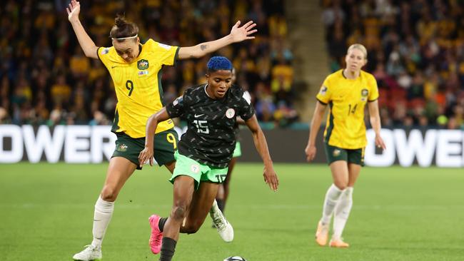 Caitlin Foord and Rasheedat Ajibade compete for the ball during the match between Australia and Nigeria at Brisbane Stadium. Picture: Lachie Millard