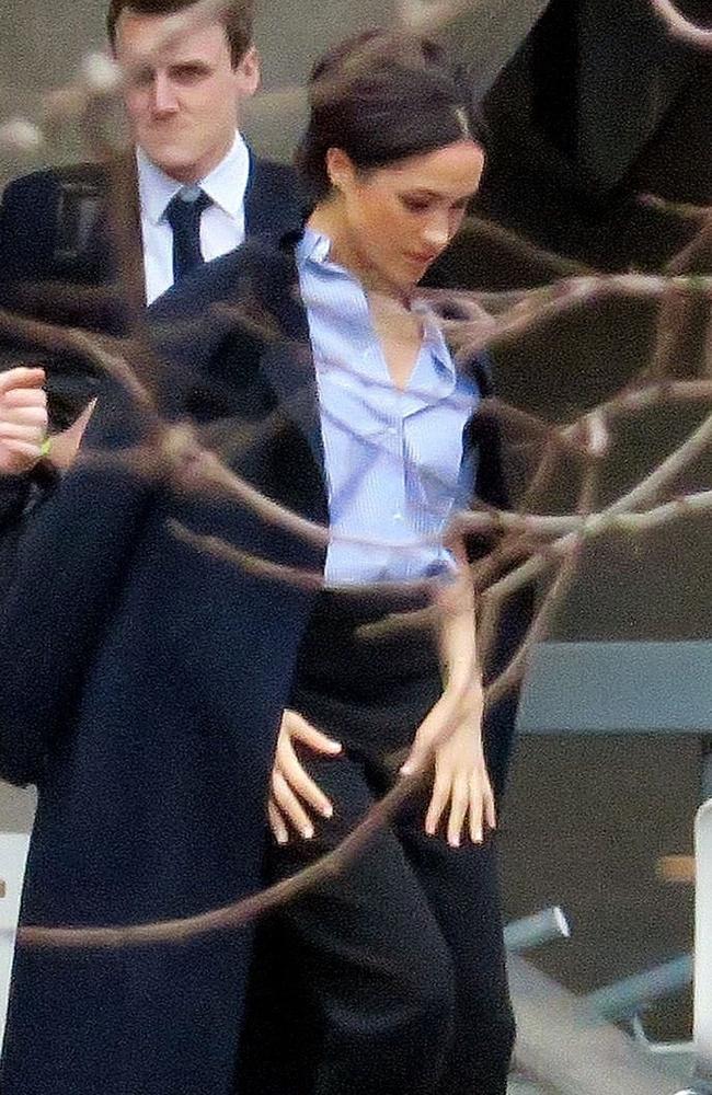 The Duchess of Sussex, Meghan Markle, leaves the Dorfman Theatre in London surrounded by her entourage. Picture: BACKGRID