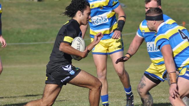 Craig Mercy-Bushell in full flight for Lower Clarence Magpies. Picture: Mekeely Heron