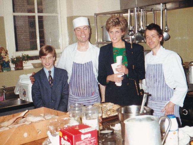 Princess Diana (2R) with her 11-year-old son William (L), now Prince William, Prince of Wales in the kitchens during one of his first visits to homelessness charity, The Passage in London, taken on December 14, 1993. Picture: AFP