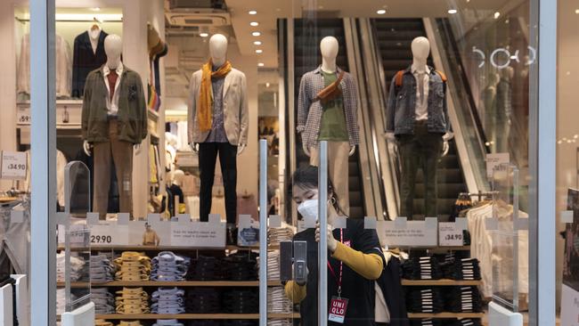 A Uniqlo employee wearing a face mask. Picture: Dan Kitwood/Getty Images.