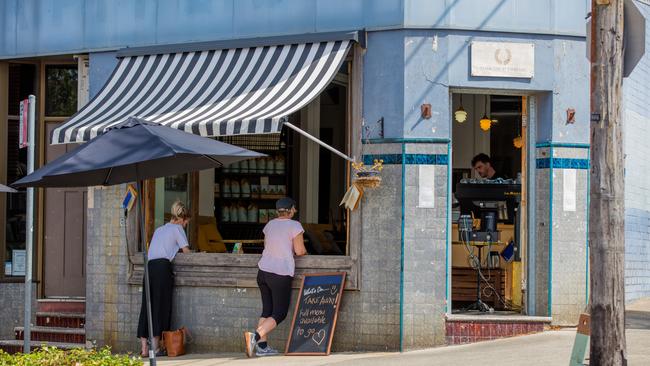 People line up to get takeaway coffee and lunch from The Little Marionette Cafe, Annandale. Picture: Adrian Fowler.