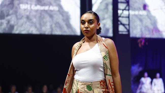 Amariah Savage wears a design by the Tafe Cultural Arts students at the Cairns Indigenous Art Fair fashion performance, Woven, held at the Tanks Arts Centre, Edge Hill. Picture: Brendan Radke
