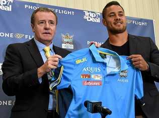 HUGE COUP: Titans CEO Graham Annesley presents Jarryd Hayne with a Titans jersey as coach Neil Henry looks on. Picture: DAN PELED