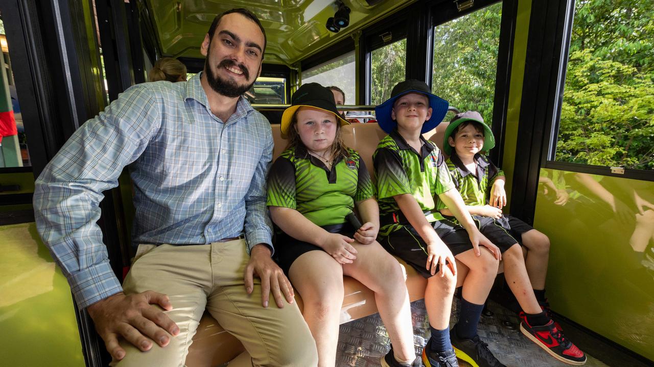 Country Liberal Party Andrew Mackay MLA, Imogen Elder, Ruben Tugwell and Sonny McAlpine from Berry Springs Primary School eagerly took a trip on the Territory Wildlife Park's two new electric trains, February 7, 2025. Picture: Pema Tamang Pakhrin