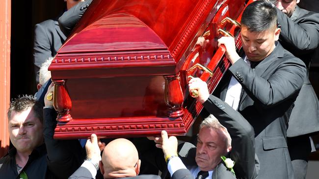 Karen's brother Stephen Williams (left) and Borce Ristevski (right) carry her coffin out of the church. Picture: Nicole Garmston