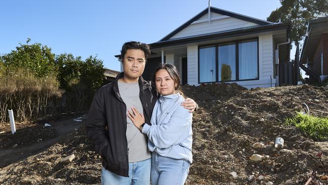 Gian David with his partner, Rizelle Fontelar at home in Woodcroft, where they out of $15,000 out of pocket after Adelaide Exposed Concrete went bust. Picture: Matt Loxton