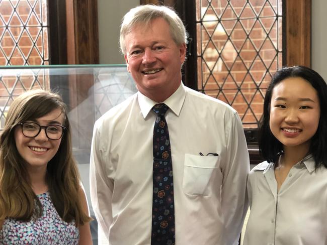 PLC Sydney headmaster Dr Paul Burgis with Year 12 students, Eleanor Lawton-Wade (left) and Rebekah Kang (right) - both students achieved the highest ATARs possible - 99.95