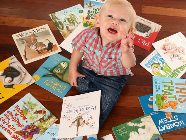 Theo Smith, 1, checks out The Great Australian Storybook Collection. Picture: Liam Kidston.