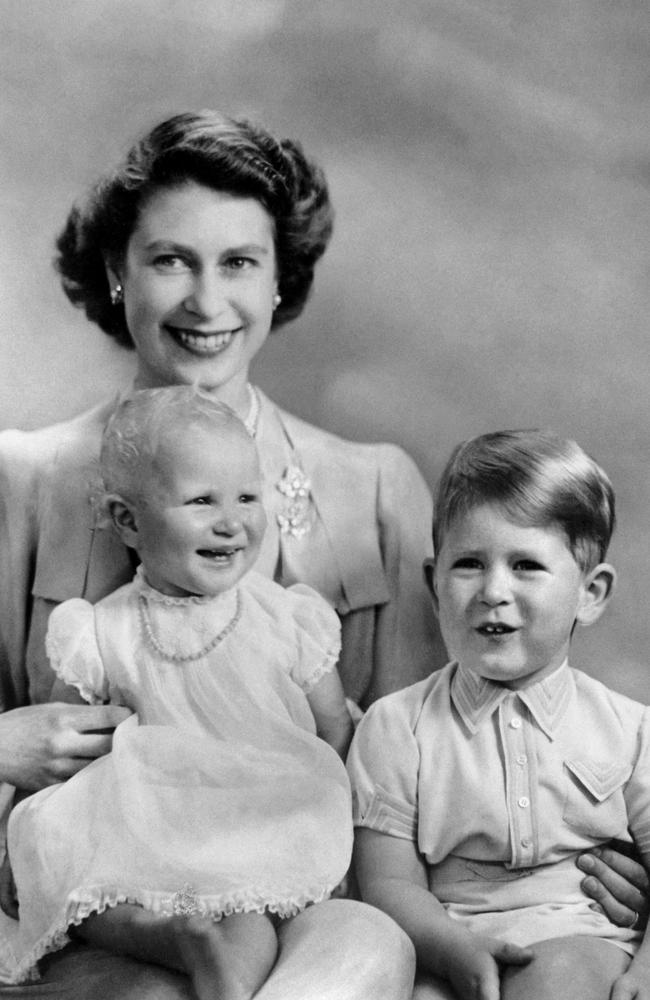 Princess Elizabeth poses with her two children Princess Anne and Prince Charles in 1951.