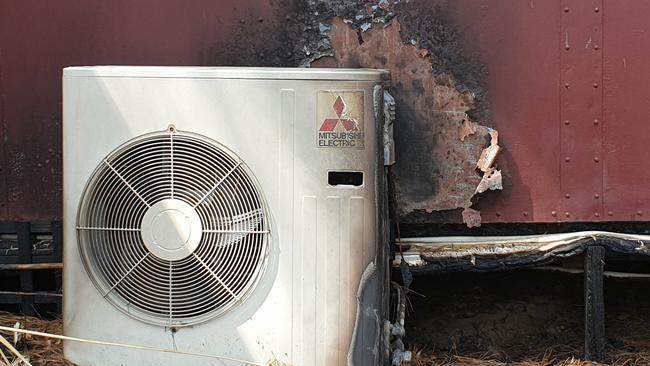 A fire-damaged air-conditioning unit outside a train carriage at Madison’s Mountain Retreat. Picture: Isabell Petrinic