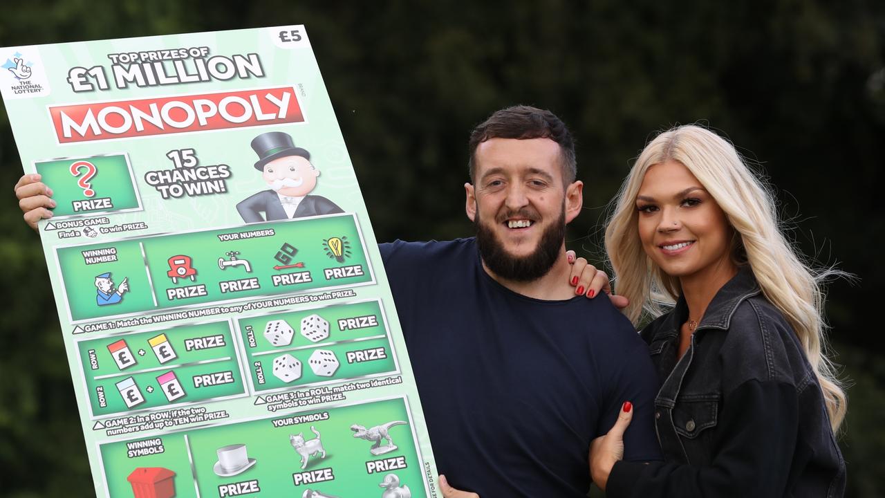 Darren and Kate Donaghey from Newcastle, celebrate their win. Picture: Owen Humphreys/PA Wire/AAP