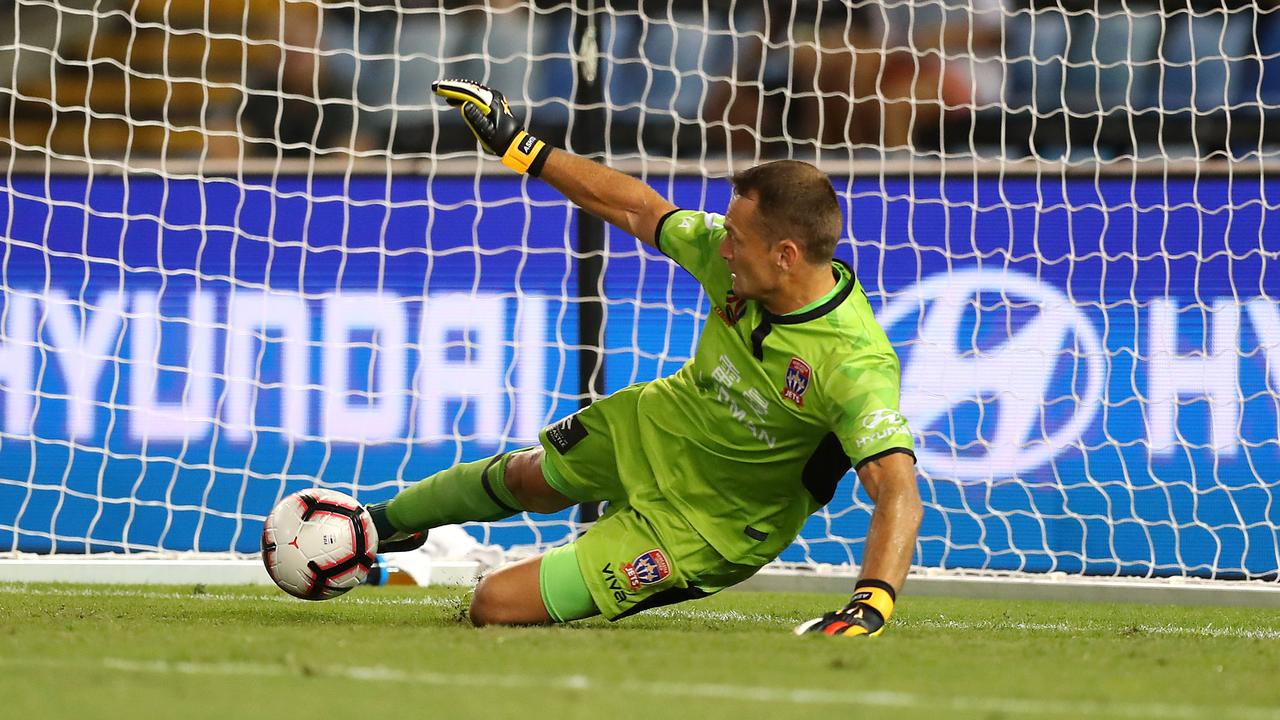 Glen Moss of the Newcastle Jets saves a penalty
