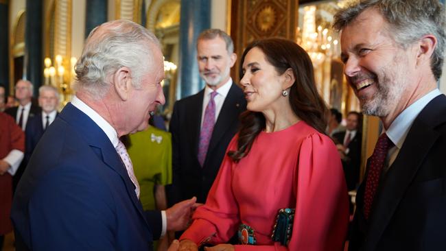 King Charles III greets Princess Mary and Crown Prince Frederik during a reception at Buckingham Palace for overseas guests attending his coronation in May. Picture: Getty Images