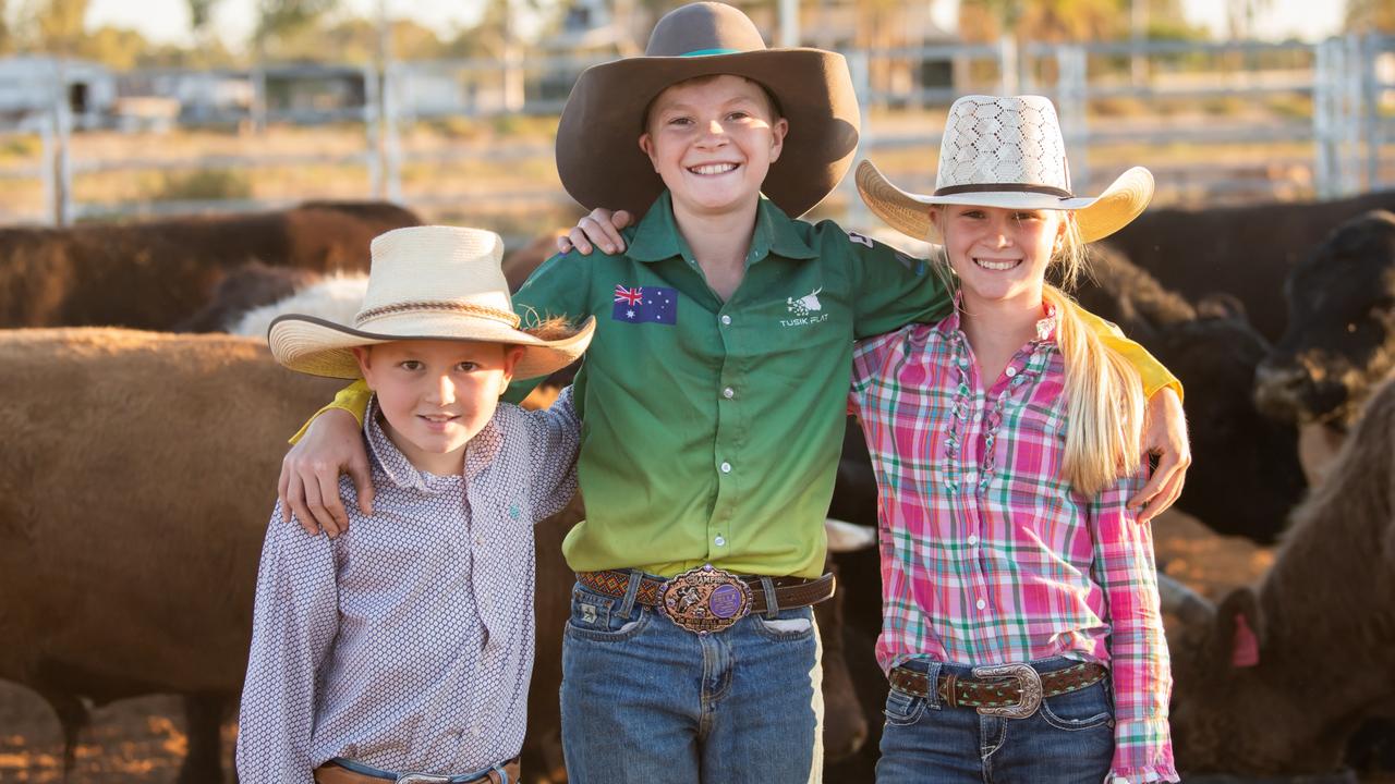 The Quilpie Show in September is a big event on the town’s annual calendar and might be bigger next year given overwhelming interest in the town’s bid to bring in workers and families with land grants. Clay Egan, centre, is pictured at this year’s show with his sister Gabby Egan at right and neighbour Lachlan Heinemann.
