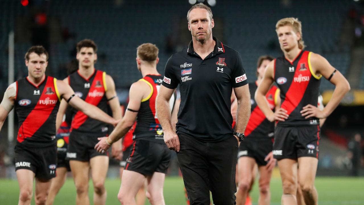 MELBOURNE, AUSTRALIA - AUGUST 14: Ben Rutten, Senior Coach of the Bombers looks dejected after a loss during the 2022 AFL Round 22 match between the Essendon Bombers and the Port Adelaide Power at Marvel Stadium on August 14, 2022 in Melbourne, Australia. (Photo by Michael Willson/AFL Photos via Getty Images)