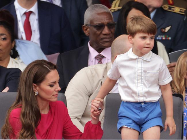 Kate Middleton holds Prince Louis as he stands on his seat. Picture: AFP