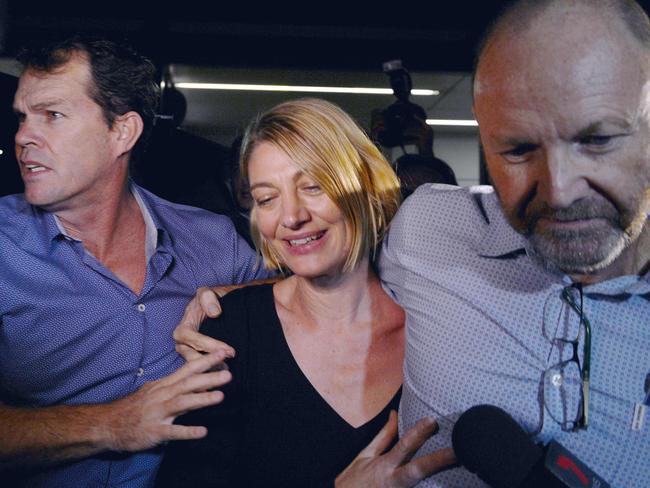 Stephen Rice, right, and journalist Tara Brown, middle arrive back in Australia after being released from prison in Beruit / AFP