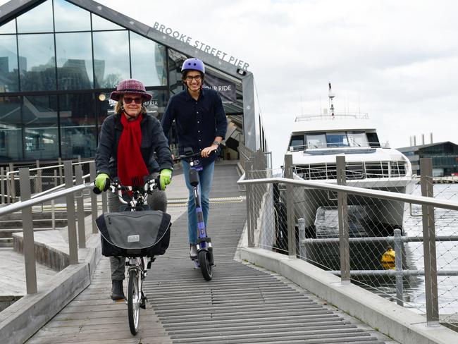 Cyclist Di Elliffe, of Hobart, and e-scooter rider Josh Wise, of Sandy Bay, in front of the River Derwent Ferry.  Picture:  City of Hobart