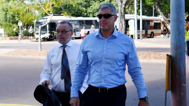 Former NT Police Assistant Commissioner Peter Bravos arrives at Darwin Local Court with barrister John Lawrence SC. Picture: Keri Megelus