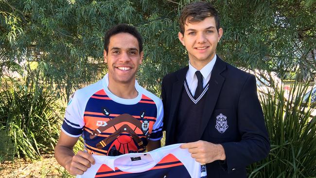 St Mary's player Samual Elara and year 12 student Karne Young who designed the indigenous themed jersey which the side will wear in the Langer Cup match against Marsden State High School.