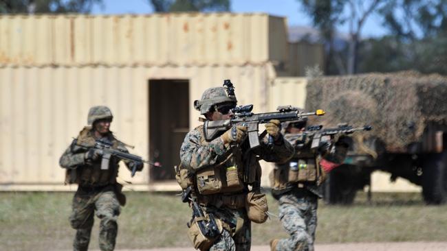 US Marines in conjunction with Australian soldiers from Battle Group Eagle comprising of elements of 3rd Brigade conduct an urban clearance of a fictitious invading force at the Townsville Filed Training Area. US Marines in connection with M1 A1 Abrams tanks from 2nd Calvary Regiment began an urban clearance at the Urban Operations Training Facility. Picture: Evan Morgan