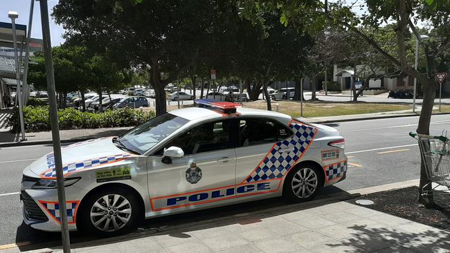 A police car remains outside a building in Southport after a person fell to their death. Picture: Brianna Morris-Grant