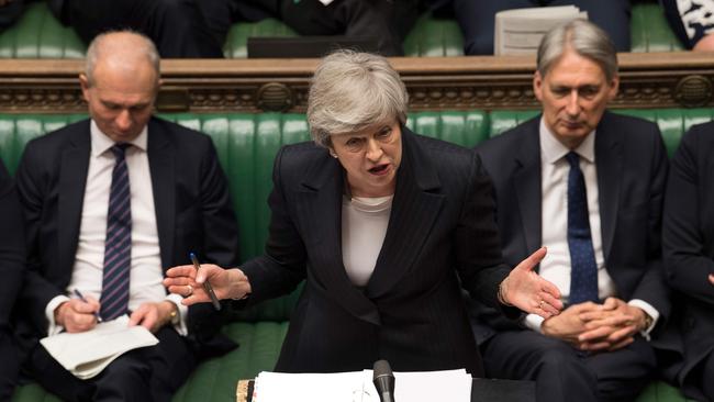 A handout photograph taken and released by the UK Parliament on May 22, 2019 shows Britain's Prime Minister Theresa May during the weekly Prime Minister's Questions (PMQs) question and answer session in the House of Commons in London. (Photo by MARK DUFFY / various sources / AFP) / EDITORS NOTE THE IMAGE HAS BEEN DIGITALLY ALTERED AT SOURCE TO OBSCURE VISIBLE DOCUMENTS  - RESTRICTED TO EDITORIAL USE - NO USE FOR ENTERTAINMENT, SATIRICAL, ADVERTISING PURPOSES - MANDATORY CREDIT " AFP PHOTO /MARK DUFFY/ UK Parliament"